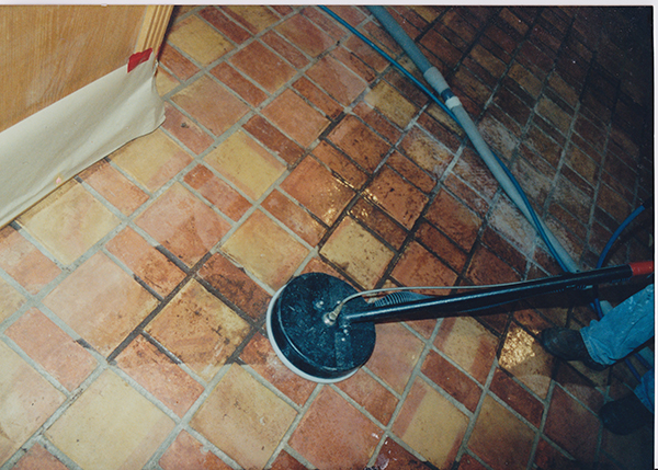 Cleaning and removal of old finishes on saltillo floors by Texas Floor Restoration